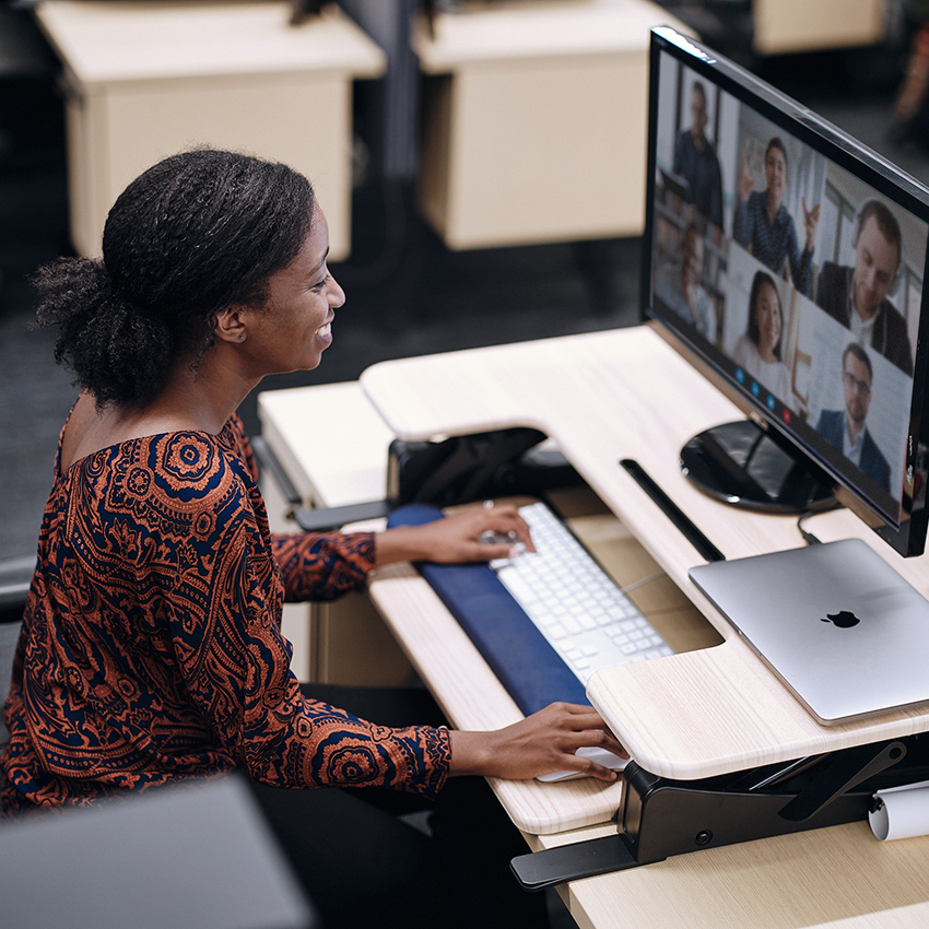 Research and strategy manager, Sanya Chandler, building client relationships over a zoom call from her desk.